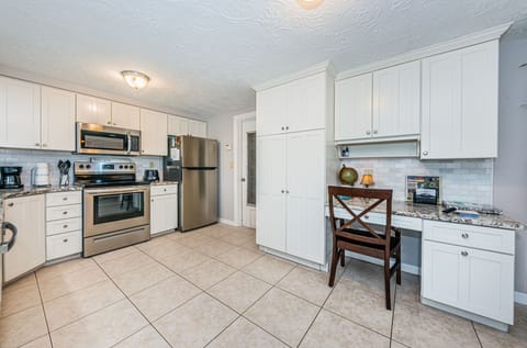 Plenty of space in the large pantry cabinet and a built-in desk for remote work