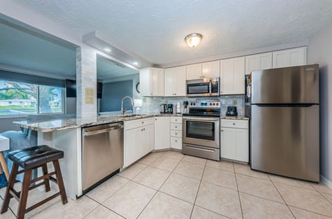 Recently remodeled kitchen with stainless appliances and brand new countertops