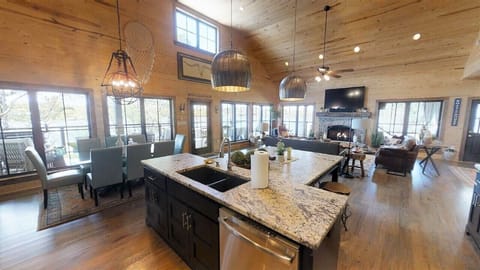 The ktichen is appointed with '"Leathered" granite countertops. A massive island
