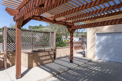 Trellace to shade parking with built-in BBQ for grill masters!