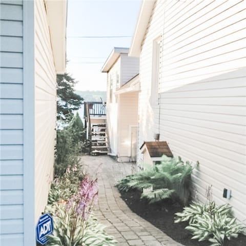 Beautifully landscaped and easy street access to cottage, decks or water.