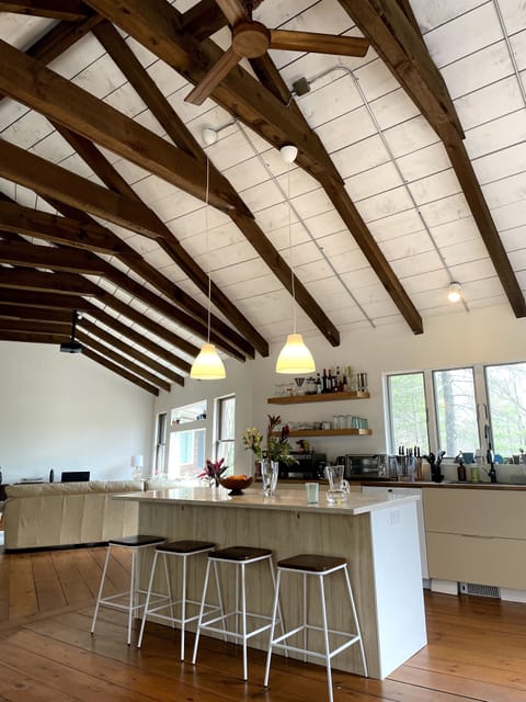 A big open living space upstairs: a view of the kitchen and living area