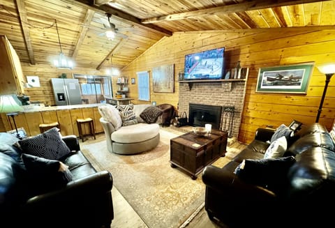 Living Room - 55” Samsung Smart TV, Wood Burning Fireplace, Plenty of Seating.