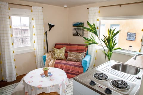 Guest suite features sitting area, stove and small fridge.