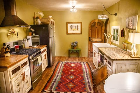 Updated kitchen; new floors, cabinets and counters, range hood, paint, lighting.