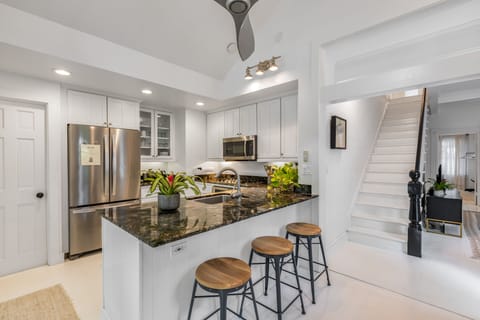 Kitchen is in the middle of it all- close to living, outdoor living, upstairs