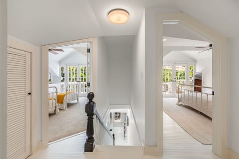 View from top of stairs to each bedroom