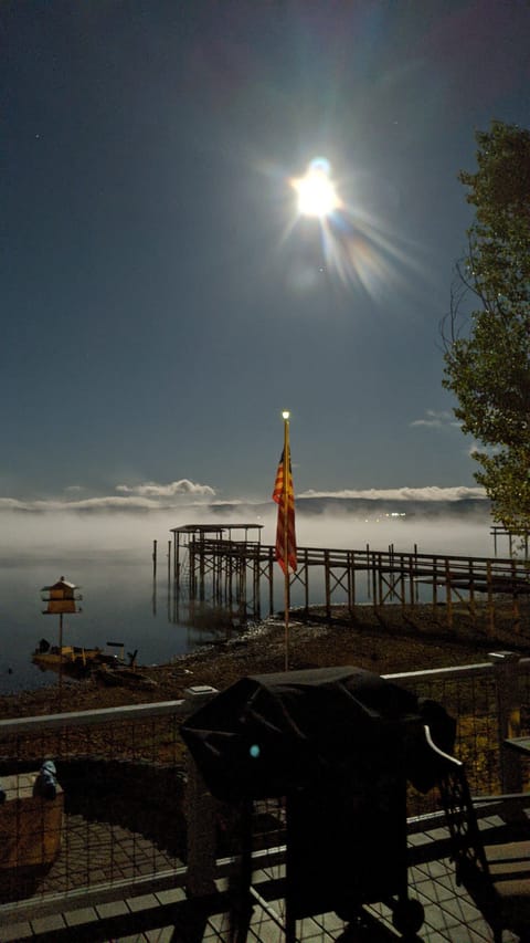 Supermoon over foggy Lake
