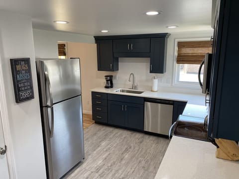 Kitchen view of stainless refrigerator