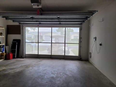View from inside the garage with the actual garage door open, but the screen is closed.