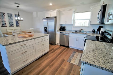 The well equipped kitchen is perfect for preparing the daily catch or grabbing a quick bite.