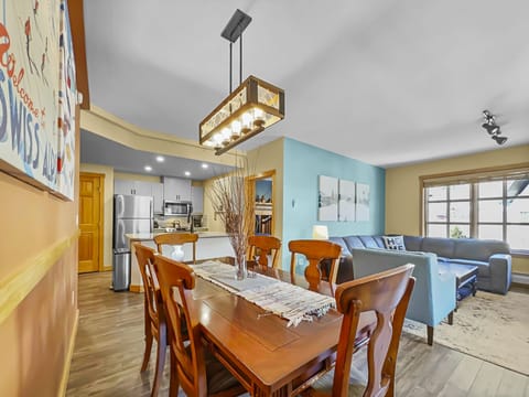 Large dining room table opening up to kitchen and living areas.