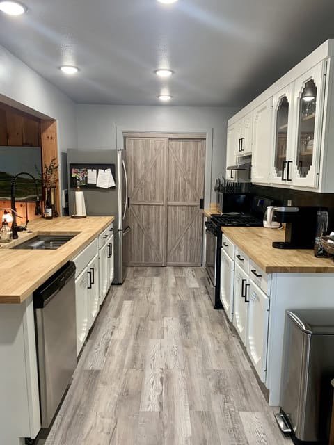 Looking towards the pantry with washer/dryer.