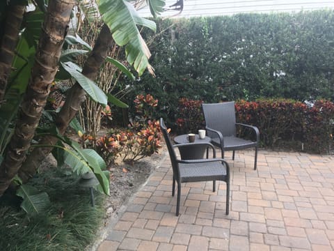 Seating in lush paver patio
