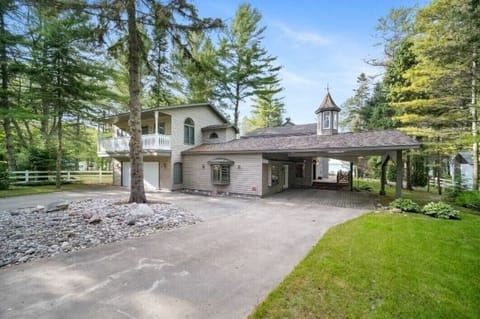 Carport separate entrance to the main house on the deck
