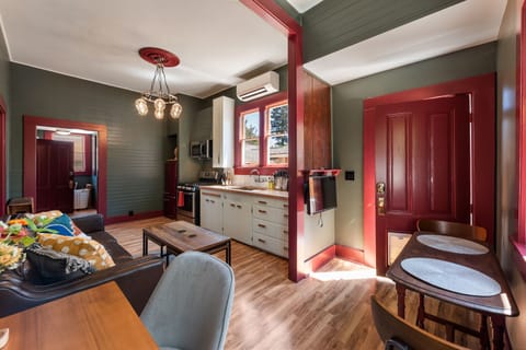 Door with dog door leads to private patio area 