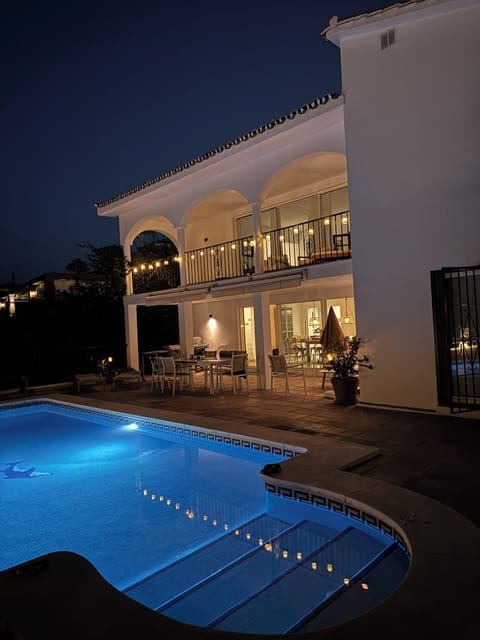 House from pool site evening