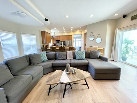 Family room with large sectional to relax and watch TV.