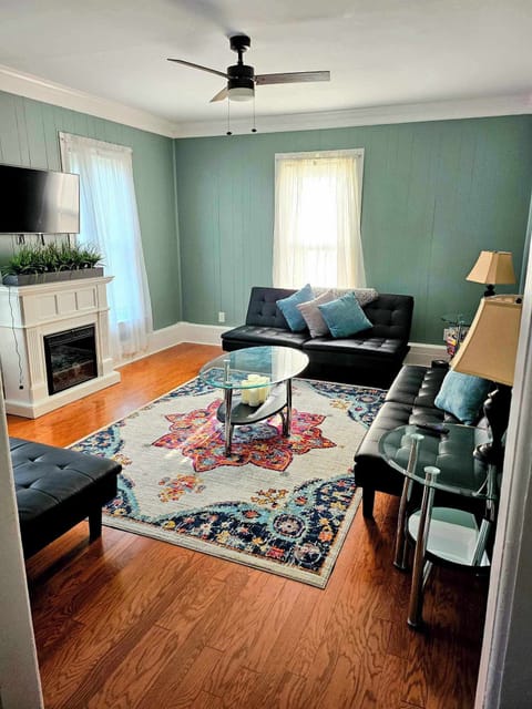 Living room, which is set off the dining room, includes 3 sleeper futons