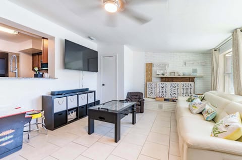 More Space to Play! Relax on the comfortable couch or challenge a friend to a game of foosball. Includes a second large smart TV and stylish fireplace accent.
