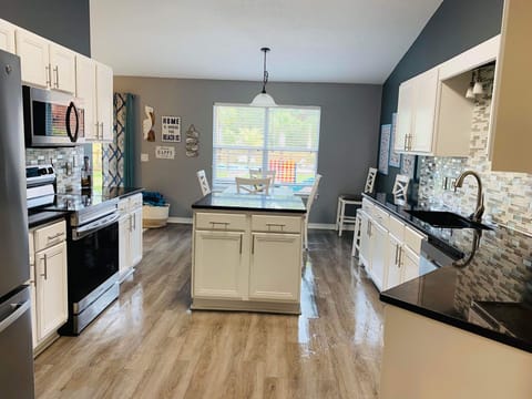 Kitchen with plenty of counter space and nice island for preparing your meals