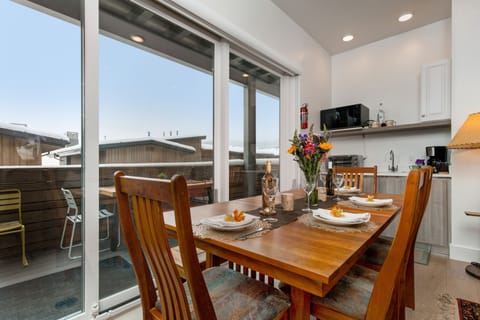 Dining Area and Kitchenette with Access to a Large Deck