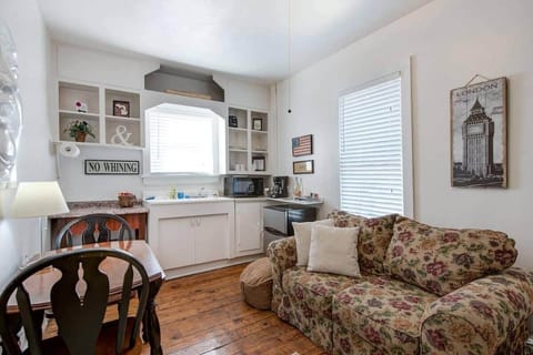 Compact convenience at its finest – our small kitchen area with microwave, coffee maker, mini fridge, and sink for your quick bites and drinks.