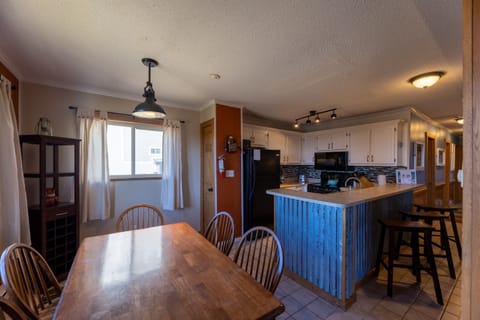 This kitchen is fully equipped with stove/oven, microwave, refrigerator, dishwasher, regular coffee maker, single cup coffee maker, toaster, blender, crock pot, pots and pans