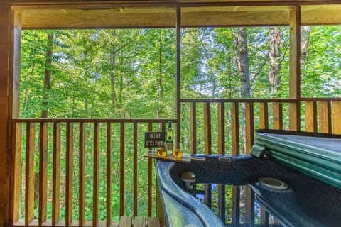 Relax among the trees in the Hot Tub!