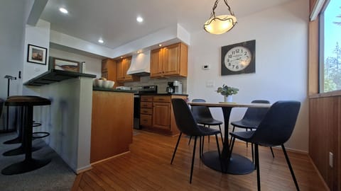 Kitchen, dining and bar seating with a view.