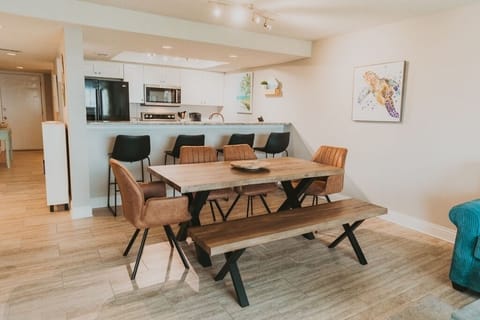 Plenty of seating at this large table and bar area.
