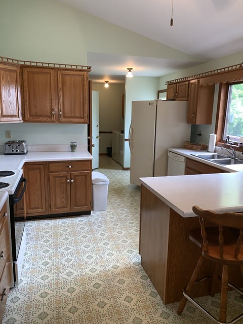 Kitchen looking toward laundry area and 1/2 bath. 