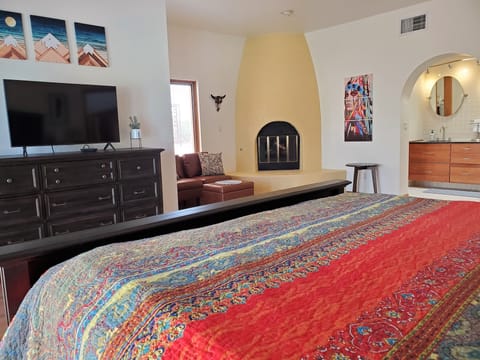 Master Bed with sitting area & Beehive Fireplace