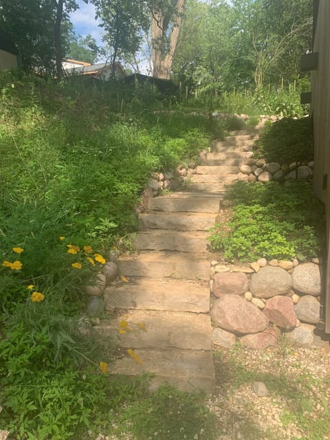 The stone staircase leads to the patio at the back of the house.