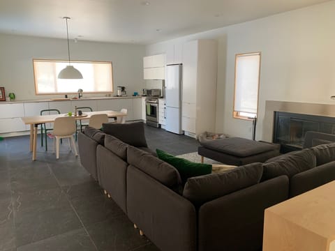 The kitchen has a large window overlooking the patio, and wildflower hill.