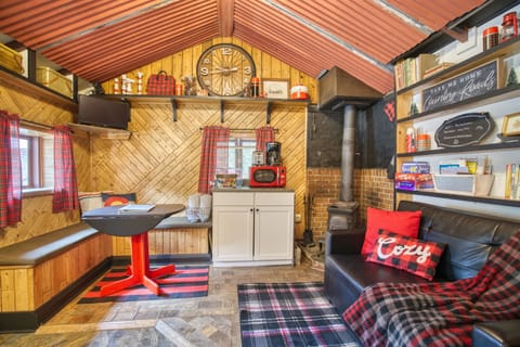 Charming banquette seating is perfect for dining in, board games, or a remote work space with mountain views.