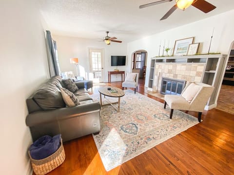 The original hardwood floors add a luster to this well appointed living room. 