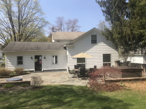Amazing patio and backyard with fire pit and hot tub.  Patio table for 6.