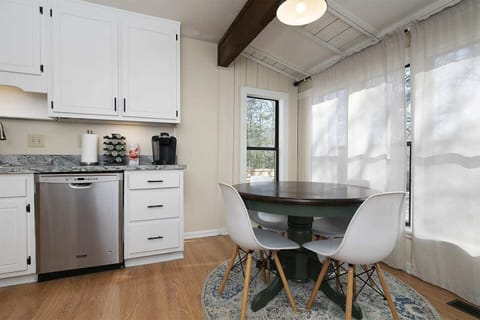 Tables and chair set up in the kitchen, perfect for snacks or while you are having a good cup of coffee in the morning.