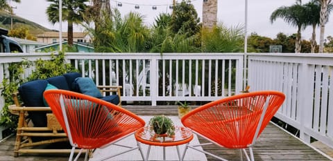 Enjoy the sunny deck, vintage rattan sofa and chairs on our tropical deck.