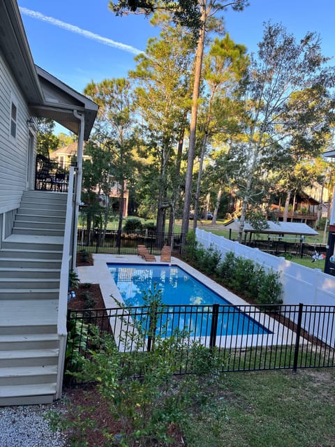Beautiful side yard pool is one of many highlights of house