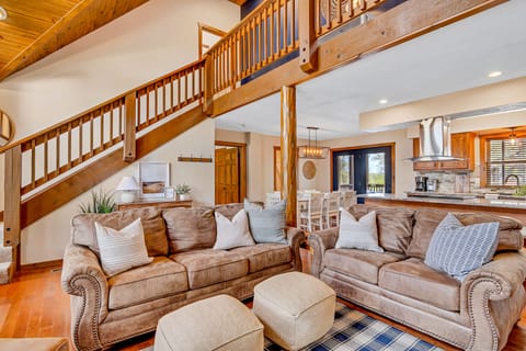 Sink right into the leather couches and enjoy the open feel of this comfy cabin!