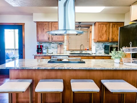 Seating for 4 at the bar and a beautifully updated kitchen staring back at you!