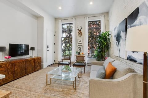 Beautiful living room space equipped with TV perfect for viewing Netflix 