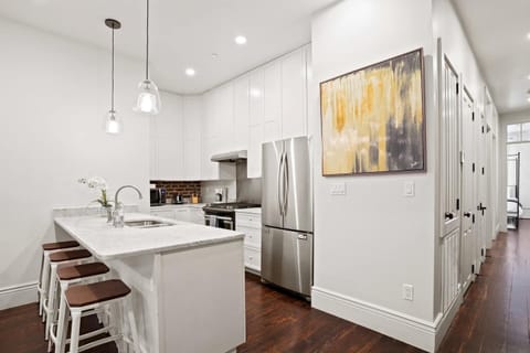 Kitchen space and view of the hallway to the bedrooms