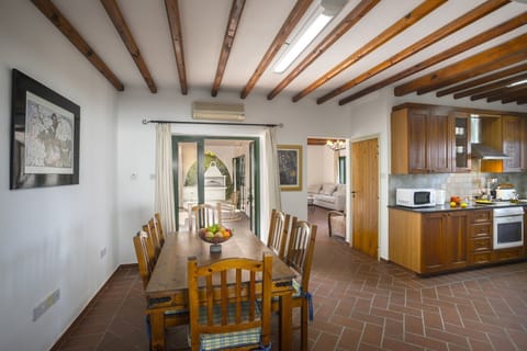 Dining area with seating for 6 people and patio door leading to the back garden 