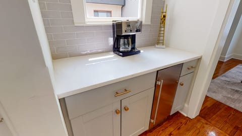 Coffee Station between Kitchen and Dining Room with Under Cabinet Ice Maker