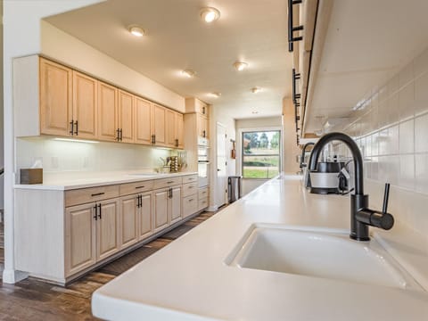Plenty of counter space and dual sinks for creating family meals.