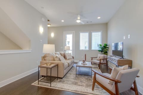 Bright, open living room with a comfortable sofa, coffee table, and plenty of natural light