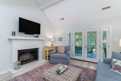 French doors off the great room lead out to the screen porch